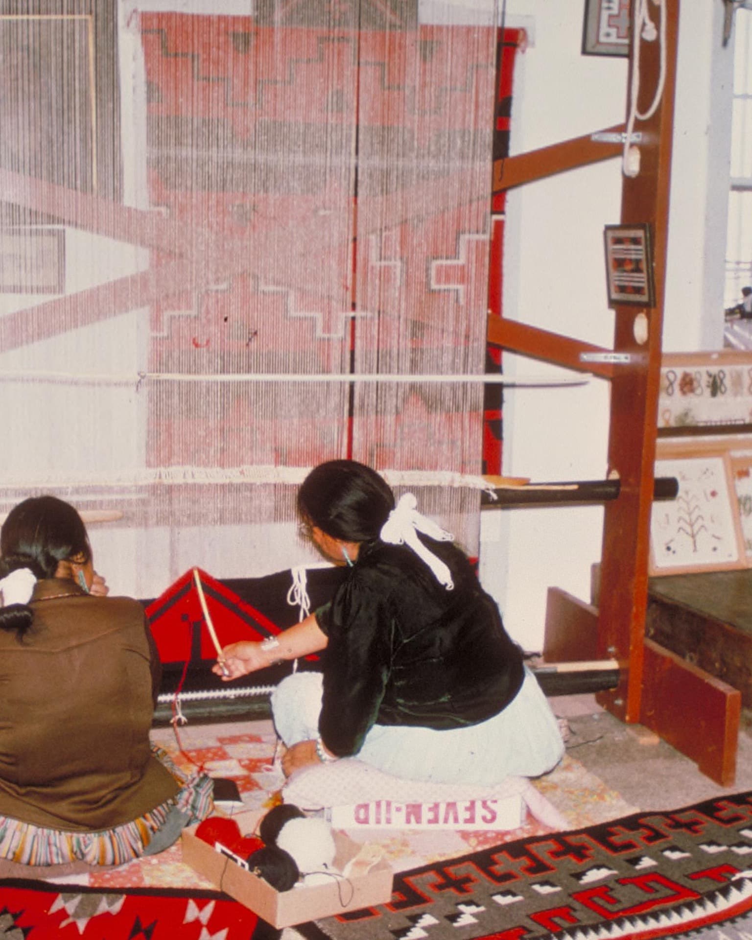 Diné weavers at a loom at Hubbell Trading Post National Historic Site, Arizona
